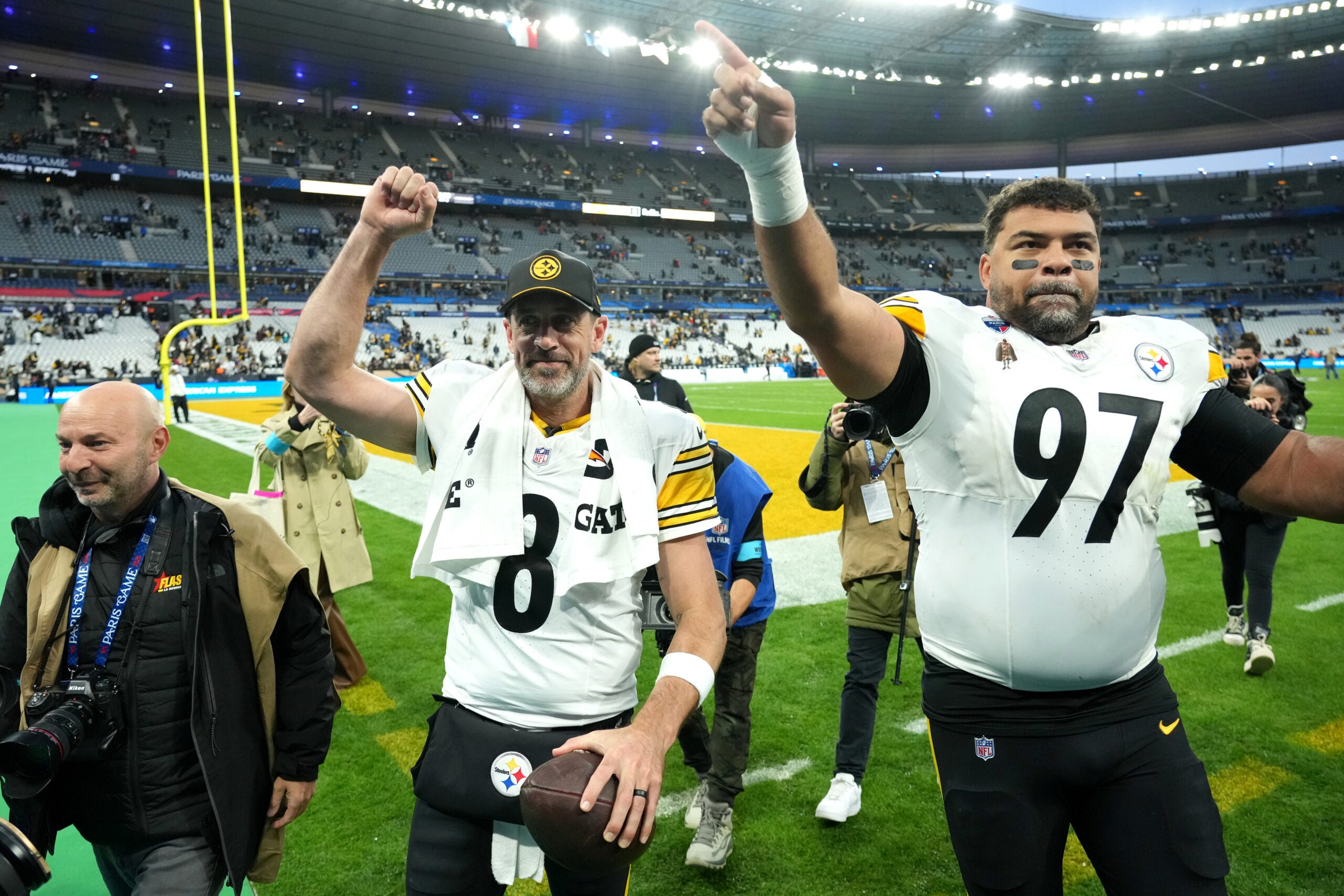 Oct 25, 2026; Paris, FRA; Pittsburgh Steelers quarterback Aaron Rodgers (8) and defensive tackle Cameron Heyward (97) wave to fans as they leave the field after defeating the New Orleans Saints at Stade de France Stadium.