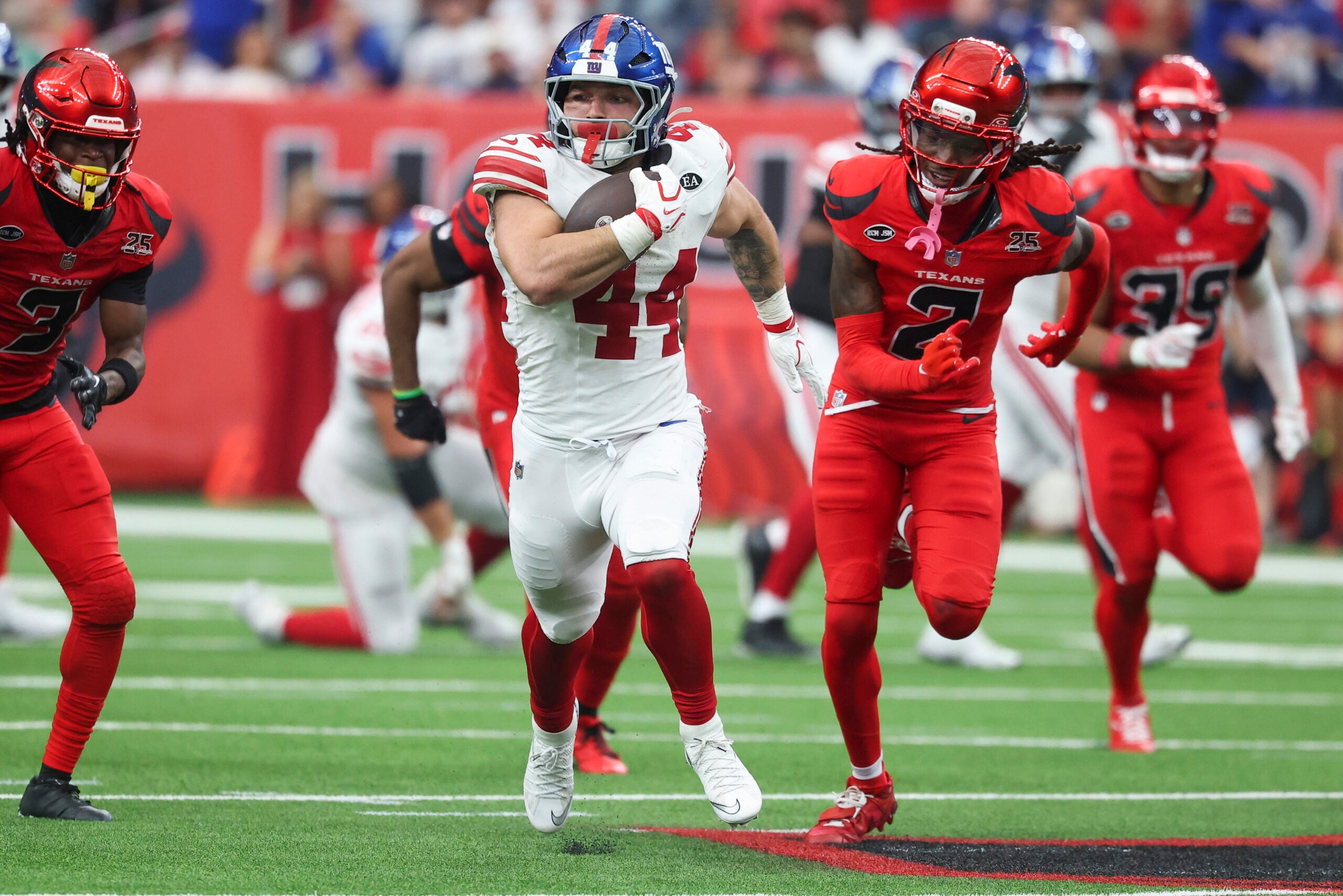Oct 25, 2026; Houston, Texas, USA; New York Giants running back Cam Skattebo (44) runs with the ball during overtime against the Houston Texans at Reliant Stadium.