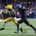 Oct 25, 2026; Detroit, Michigan, USA; Green Bay Packers wide receiver Savion Williams (83) runs the ball against Detroit Lions cornerback Ennis Rakestraw Jr. (2) during the first quarter at Ford Field.