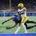 Oct 25, 2026; Detroit, Michigan, USA; Detroit Lions wide receiver Isaac TeSlaa (18) reaches for a pass against Green Bay Packers cornerback Keisean Nixon (25) at Ford Field.