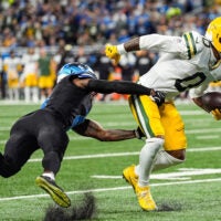 Detroit Lions cornerback D.J. Reed (4) tackles Green Bay Packers wide receiver Matthew Golden (0) during the first half at Ford Field in Detroit on Sunday, Oct. 25, 2026.