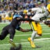 Detroit Lions cornerback D.J. Reed (4) tackles Green Bay Packers wide receiver Matthew Golden (0) during the first half at Ford Field in Detroit on Sunday, Oct. 25, 2026.