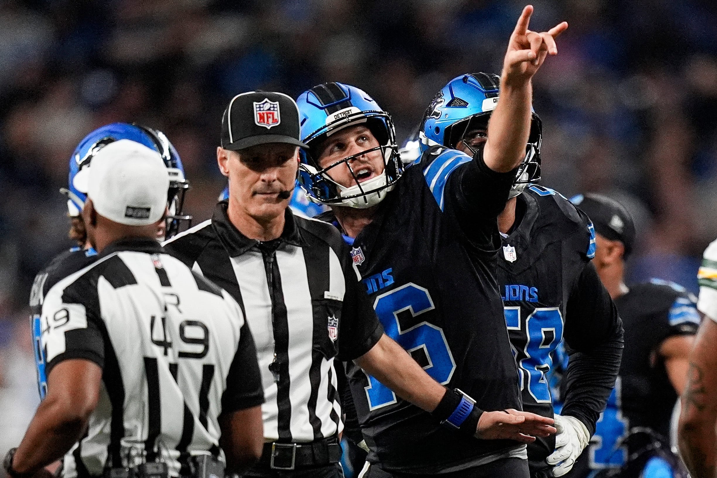 Detroit Lions quarterback Jared Goff (16) talks to a referee regarding a play against Green Bay Packers during the second half at Ford Field in Detroit on Sunday, Oct. 25, 2026.