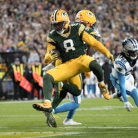 Oct 29, 2026; Green Bay, Wisconsin, USA; Green Bay Packers running back Josh Jacobs (8) rushes for a touchdown against the Carolina Panthers in the first half at Lambeau Field.
