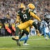 Oct 29, 2026; Green Bay, Wisconsin, USA; Green Bay Packers running back Josh Jacobs (8) rushes for a touchdown against the Carolina Panthers in the first half at Lambeau Field.