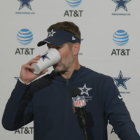 Dallas Cowboys head coach Brian Schottenheimer talks to reporters postgame following win over Philadelphia Eagles in Week 7.